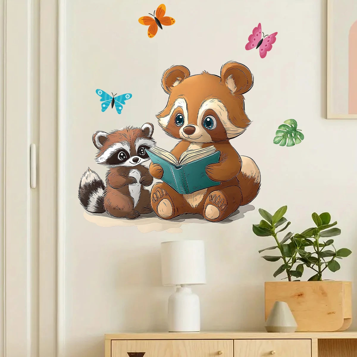 Close-up view of Cartoon Parent Child Raccoon Reading Wall Decal | Room Decor by HomeDecorDecals.